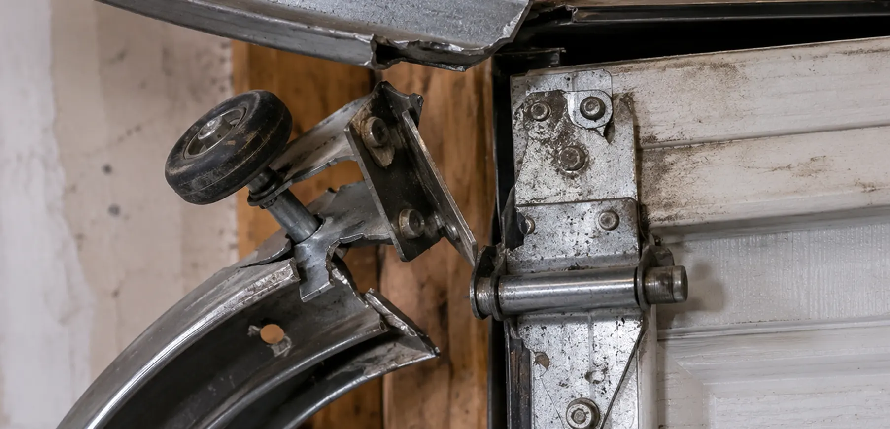 Old garage door roller before replacement